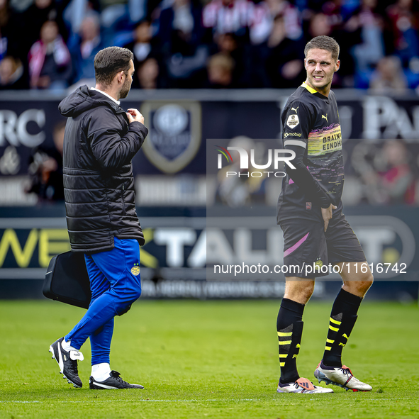 PSV Eindhoven midfielder Joey Veerman gets injured during the match between Willem II and PSV at the Koning Willem II stadium for the Dutch...