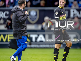 PSV Eindhoven midfielder Joey Veerman gets injured during the match between Willem II and PSV at the Koning Willem II stadium for the Dutch...