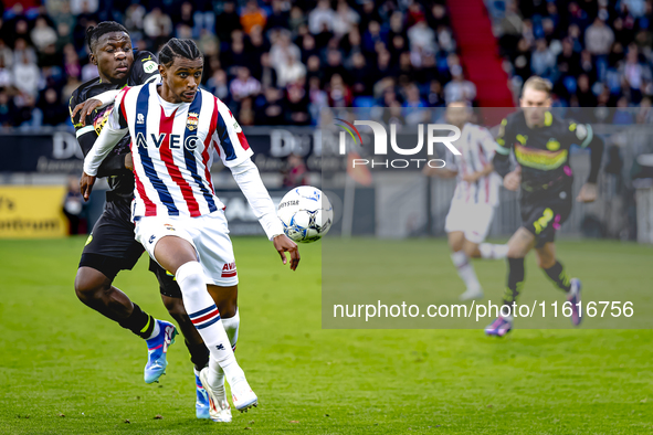 PSV Eindhoven forward Johan Bakayoko and Willem II forward Amar Fatah during the match Willem II vs. PSV at the Koning Willem II stadium for...