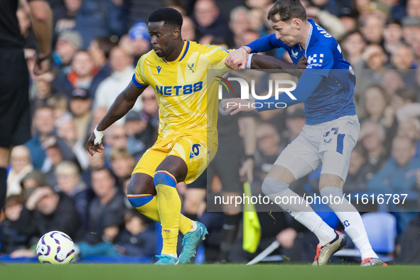 Marc Guehi #6 of Crystal Palace F.C. possesses the ball during the Premier League match between Everton and Crystal Palace at Goodison Park...