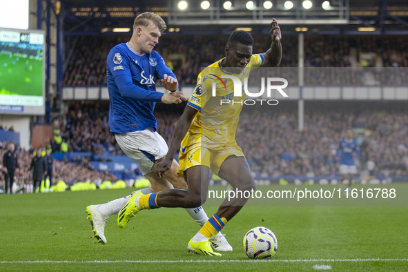 Ismaila Sarr #7 of Crystal Palace F.C. is tackled by the opponent during the Premier League match between Everton and Crystal Palace at Good...