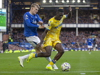 Ismaila Sarr #7 of Crystal Palace F.C. is tackled by the opponent during the Premier League match between Everton and Crystal Palace at Good...