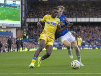 Ismaila Sarr #7 of Crystal Palace F.C. is tackled by an opponent during the Premier League match between Everton and Crystal Palace at Goodi...