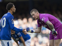 Jordan Pickford #1 (GK) of Everton F.C. and Iliman Ndiaye #10 of Everton F.C. during the Premier League match between Everton and Crystal Pa...