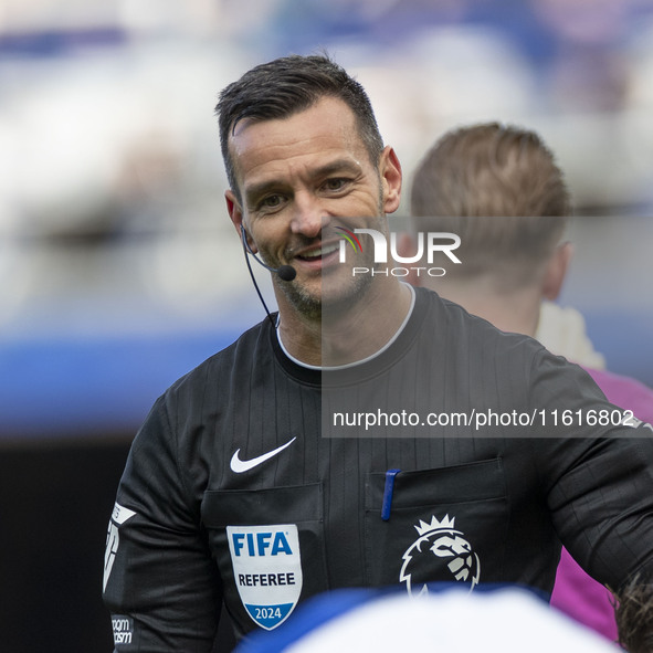 Referee Andy Madley officiates the Premier League match between Everton and Crystal Palace at Goodison Park in Liverpool, England, on Septem...