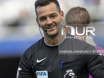 Referee Andy Madley officiates the Premier League match between Everton and Crystal Palace at Goodison Park in Liverpool, England, on Septem...