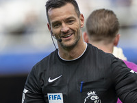 Referee Andy Madley officiates the Premier League match between Everton and Crystal Palace at Goodison Park in Liverpool, England, on Septem...