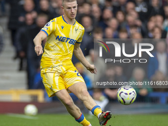 Adam Wharton #20 of Crystal Palace F.C. is in action during the Premier League match between Everton and Crystal Palace at Goodison Park in...