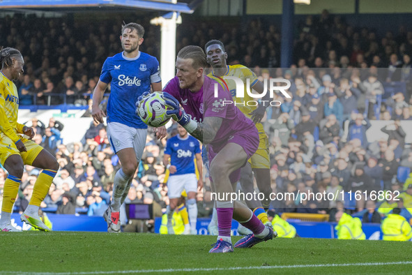 Jordan Pickford #1 (GK) of Everton F.C. makes a save during the Premier League match between Everton and Crystal Palace at Goodison Park in...