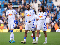 Jayden Bogle (Leeds United) stands flanked by Joe Rodon (Leeds United) and Isaac Schmidt (Leeds United) after the Sky Bet Championship match...