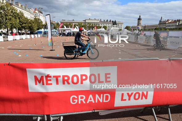 Several people test bikes during the first bikes Lyon festival in Lyon, France, on September 28, 2024. 