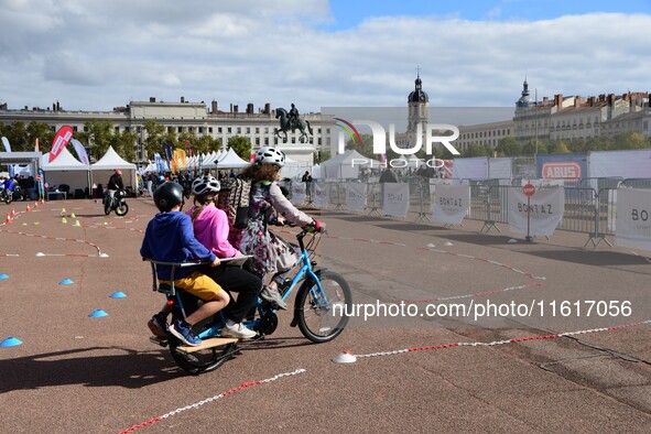 Several people test bikes during the first bikes Lyon festival in Lyon, France, on September 28, 2024. 