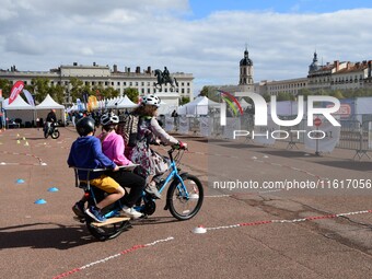 Several people test bikes during the first bikes Lyon festival in Lyon, France, on September 28, 2024. (