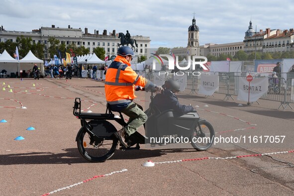 Several people test bikes during the first bikes Lyon festival in Lyon, France, on September 28, 2024. 