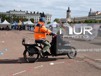 Several people test bikes during the first bikes Lyon festival in Lyon, France, on September 28, 2024. (