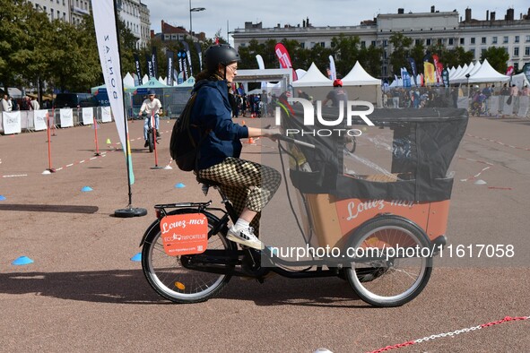 Several people test bikes during the first bikes Lyon festival in Lyon, France, on September 28, 2024. 