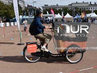 Several people test bikes during the first bikes Lyon festival in Lyon, France, on September 28, 2024. (