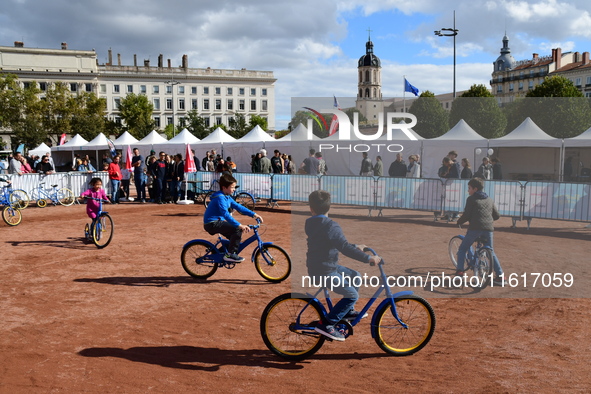 Several people test bikes during the first bikes Lyon festival in Lyon, France, on September 28, 2024. 