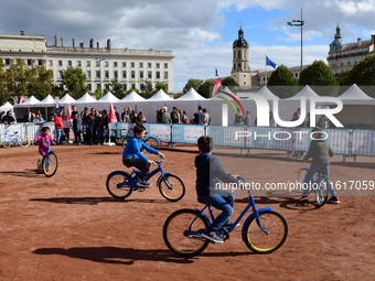 Several people test bikes during the first bikes Lyon festival in Lyon, France, on September 28, 2024. (