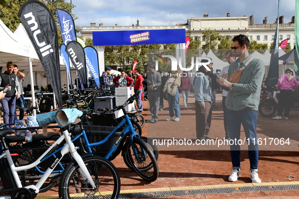 Several people test bikes during the first bikes Lyon festival in Lyon, France, on September 28, 2024. 