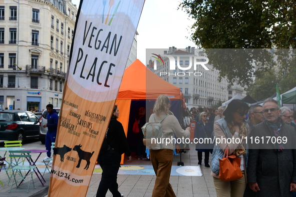 Several people visit the associative village organized by L214 in Lyon, France, on September 28, 2024. 