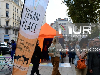 Several people visit the associative village organized by L214 in Lyon, France, on September 28, 2024. (