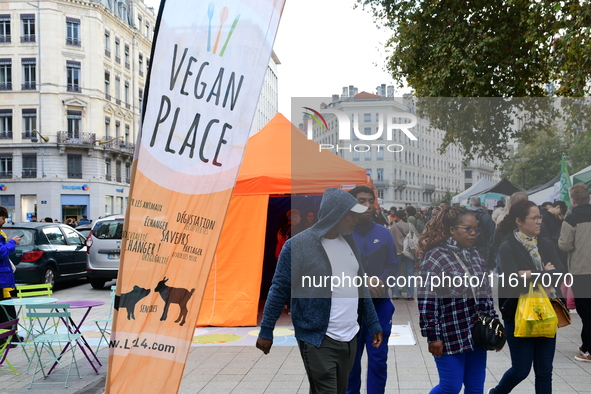 Several people visit the associative village organized by L214 in Lyon, France, on September 28, 2024. 