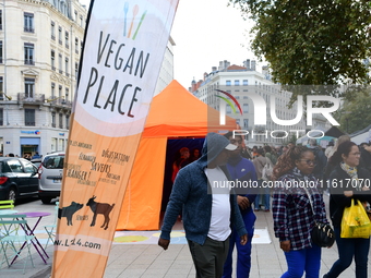 Several people visit the associative village organized by L214 in Lyon, France, on September 28, 2024. (