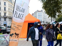 Several people visit the associative village organized by L214 in Lyon, France, on September 28, 2024. (