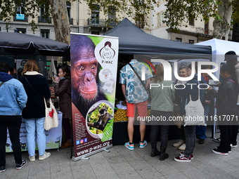 Several people visit the associative village organized by L214 in Lyon, France, on September 28, 2024. (