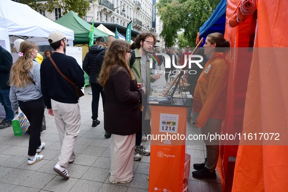 Several people visit the associative village organized by L214 in Lyon, France, on September 28, 2024. 