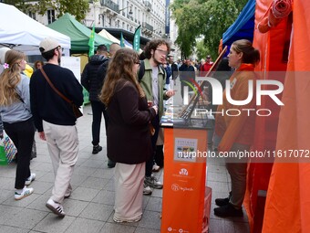 Several people visit the associative village organized by L214 in Lyon, France, on September 28, 2024. (