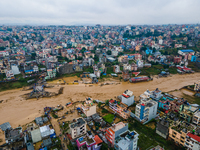 A drone view shows the Nakhu River flooding and affecting the riverbanks and homes during heavy rainfall in Lalitpur, Nepal, on September 28...