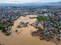 A drone view shows the Nakhu River flooding and affecting the riverbanks and homes during heavy rainfall in Lalitpur, Nepal, on September 28...