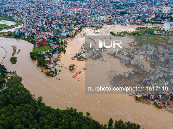 A drone view shows the Nakhu River flooding and affecting the riverbanks and homes during heavy rainfall in Lalitpur, Nepal, on September 28...