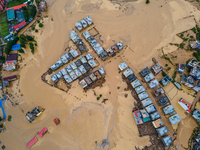 A drone view shows the Nakhu River flooding and affecting the riverbanks and homes during heavy rainfall in Lalitpur, Nepal, on September 28...