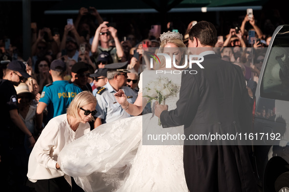 Princess Theodora Glucksburg of Greece and her brother Pavlos, former Crown Prince of Greece, arrive for her wedding with Matthew Jeremiah K...