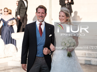 Princess Theodora Glucksburg of Greece and her brother Pavlos, former Crown Prince of Greece, arrive for her wedding with Matthew Jeremiah K...