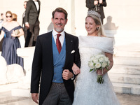 Princess Theodora Glucksburg of Greece and her brother Pavlos, former Crown Prince of Greece, arrive for her wedding with Matthew Jeremiah K...