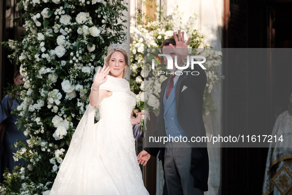 Princess Theodora Glucksburg of Greece and her brother Pavlos, former Crown Prince of Greece, arrive for her wedding with Matthew Jeremiah K...