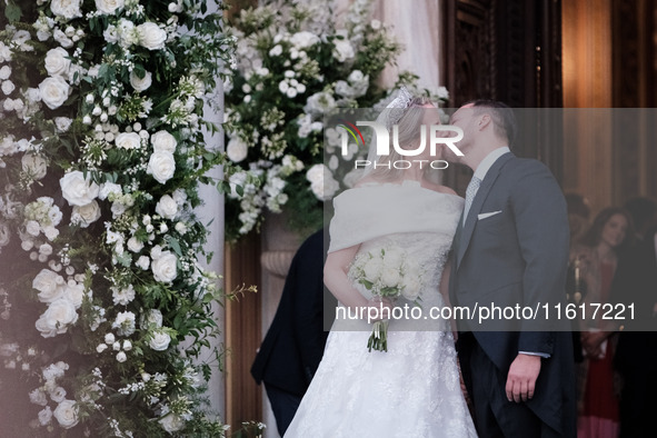 Princess Theodora Glucksburg of Greece and Matthew Jeremiah Kumar kiss each other after their wedding at the Metropolitan Cathedral in Athen...