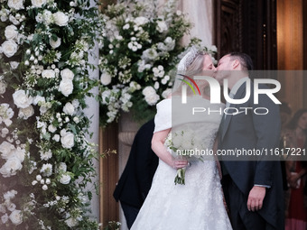 Princess Theodora Glucksburg of Greece and Matthew Jeremiah Kumar kiss each other after their wedding at the Metropolitan Cathedral in Athen...