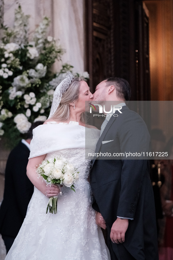 Princess Theodora Glucksburg of Greece and Matthew Jeremiah Kumar kiss each other after their wedding at the Metropolitan Cathedral in Athen...