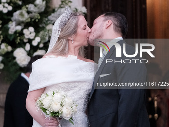 Princess Theodora Glucksburg of Greece and Matthew Jeremiah Kumar kiss each other after their wedding at the Metropolitan Cathedral in Athen...