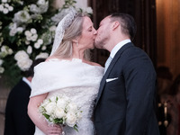 Princess Theodora Glucksburg of Greece and Matthew Jeremiah Kumar kiss each other after their wedding at the Metropolitan Cathedral in Athen...