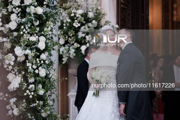 Princess Theodora Glucksburg of Greece and Matthew Jeremiah Kumar kiss each other after their wedding at the Metropolitan Cathedral in Athen...