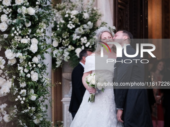 Princess Theodora Glucksburg of Greece and Matthew Jeremiah Kumar kiss each other after their wedding at the Metropolitan Cathedral in Athen...