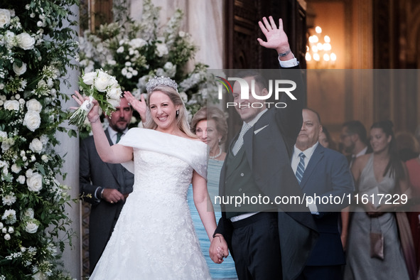 Princess Theodora Glucksburg of Greece and Matthew Jeremiah Kumar greet after their wedding at the Metropolitan Cathedral in Athens, Greece,...