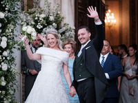 Princess Theodora Glucksburg of Greece and Matthew Jeremiah Kumar greet after their wedding at the Metropolitan Cathedral in Athens, Greece,...