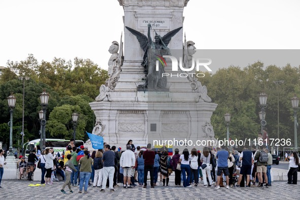 Several activists rally during a demonstration in Restauradores Square in Lisbon, Portugal, on September 28, 2024, as a result of the allege...